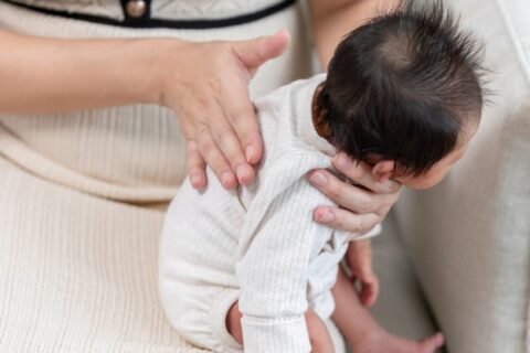 Mother Patting Newborn Baby’s back – Brevard Health Alliance