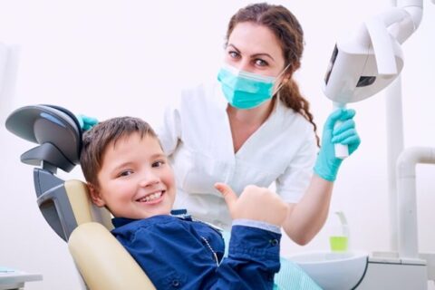 Smiling kid at the orthodontist clinic – Brevard Health Alliance