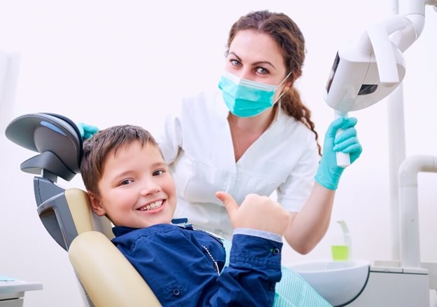 Smiling kid at the orthodontist clinic – Brevard Health Alliance