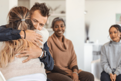 Woman hugging a man to console him for his cancer treatment in Brevard County, Florida